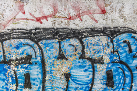 Abstract detailed wall texture with blue graffiti paint.の写真素材