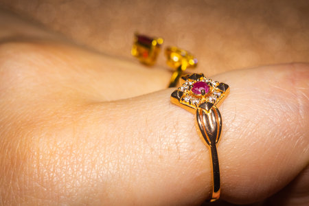 Fashion golden ring with ruby, close up background.の写真素材
