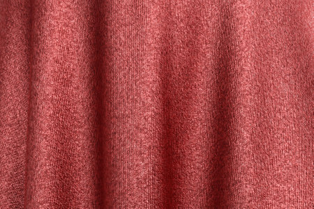 Detailed shiny red fabric background. Beautiful soft wavy folds on smooth shiny piece of cloth. Background for anniversary, Christmas, wedding, birthday, Valentine's Day, events concept. 3D Illustration.の写真素材
