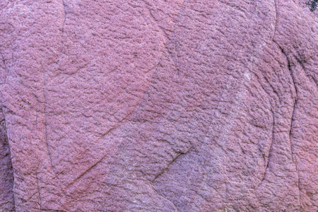 Detailed photo of granite stone surface. Close up texture of natural stone.の写真素材