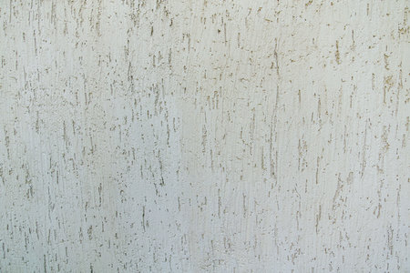Detailed texture of bark plaster, showing its weathered surface and unique pattern. Ideal for architectural, 3d design, texturing surfaces, creative grunge effect. Gray decorative texture close up.の写真素材