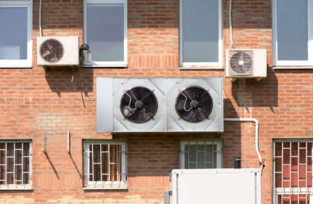 Air conditioners on the wall of a buildingの写真素材