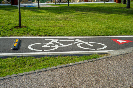 Bicycle sign with speed bumper and give way sign on a bicycle lane