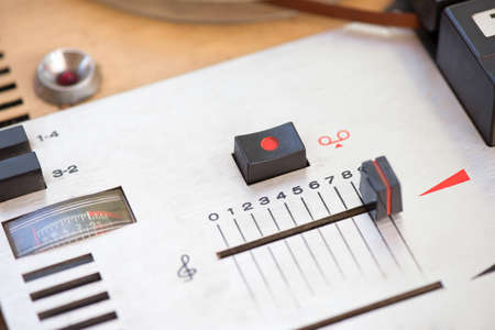 Record and volume buttons on a vintage magnetic recorderの写真素材