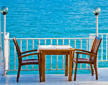 Table in a restaurant with sea view , Balchik, Bulgariaの写真素材