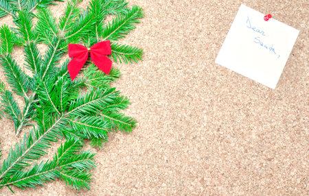 Red bow, fir tree and Dear Santa noteの写真素材