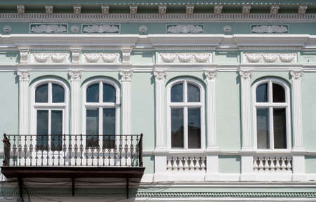 Windows and balcony detail of a buildingの写真素材