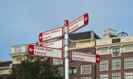 Different way sign for tourist directions in Amsterdam Netherlandsのeditorial素材