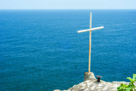 Christian cross and blue sea at Cape Kaliakra, Bulgariaの写真素材