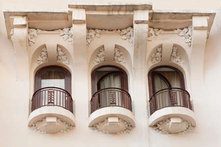 Detail of old three white balconies with white wallの写真素材
