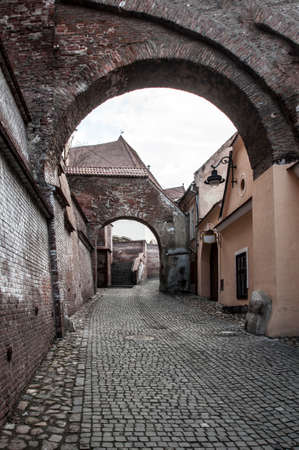 An old narrow street in Sibiu Romaniaの写真素材