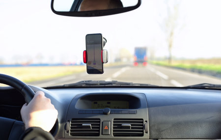 Man driving a car on a road