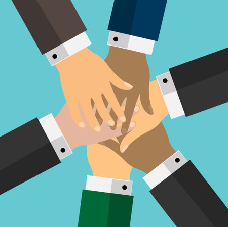 Stack of hands of different human races showing unity and teamwork