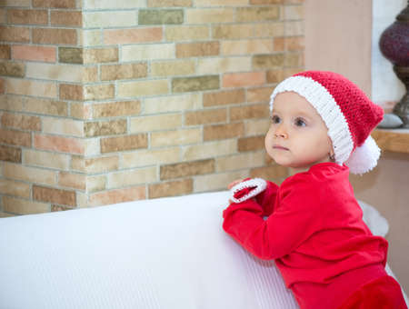 Little girl dressed in red indoors, copy spaceの写真素材