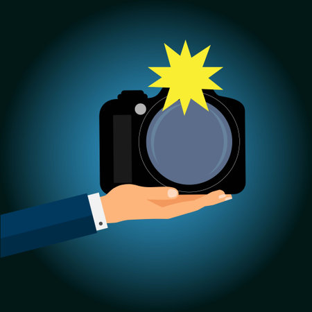 Hand presenting a modern digital single reflex camera