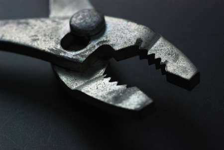 steel pliers on a dark backgroundの写真素材