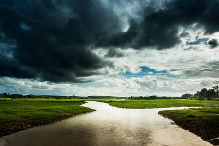 clouds floating above the reservoirの写真素材