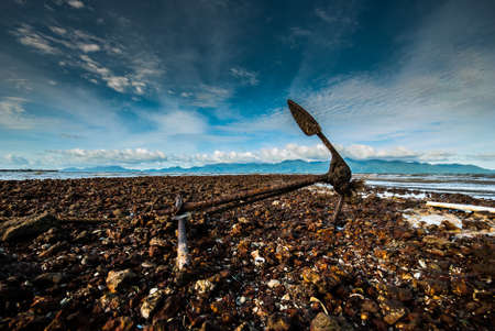 Anchor on a rocky beachの写真素材