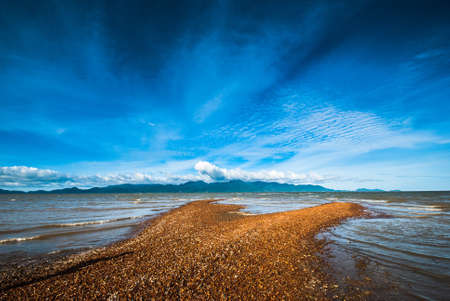 Sandbar opposite the islandの写真素材