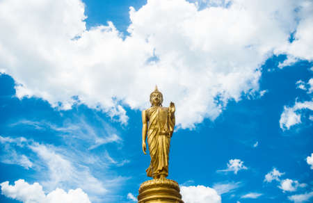 Big golden buddha statue with blue sky, Thailand の写真素材