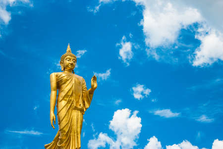 Big golden buddha statue with blue sky, Thailand の写真素材