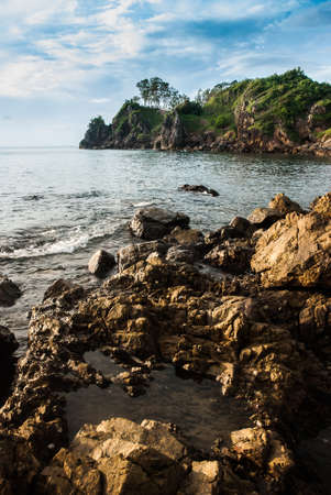 Rocky beach with sea water erosionの写真素材