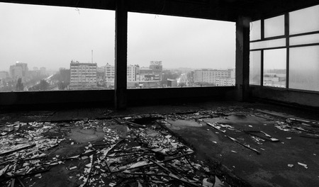 View of the city through a broken windowの写真素材