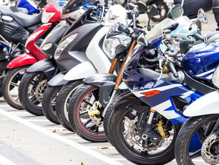 A photo of a parking of motorcycles in Barcelona. Spain. Autumn