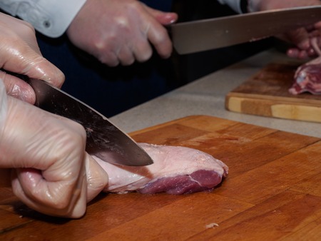 Cooking chicken in the kitchenの写真素材