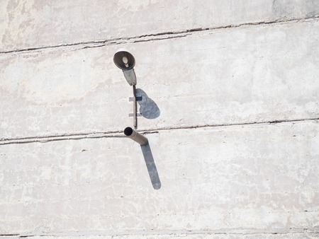 Gray wall. The lantern casts a shadow on the wall.の写真素材