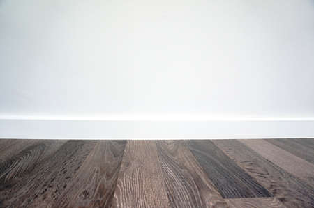 laminate floor and white wall backgroundの写真素材