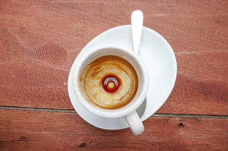 Coffee Stain in empty espresso coffee cup on the wood tableの写真素材