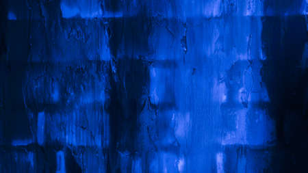 The old brick wall is blue. Dark background, brick texture.の写真素材