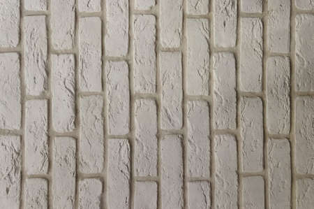 Gray, brick, old wall. The brickwork is positioned vertically. Gray background with texture.の写真素材