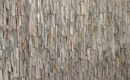 Relief texture in gray and beige. Plaster wall close-up. Gray background.