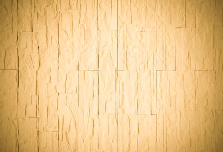 The relief texture is yellow with dents and damages. Plastered wall close-up.
Yellow background with vignette.の写真素材