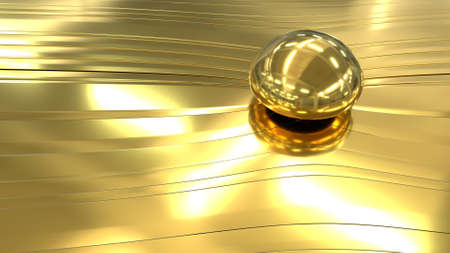 Golden abstraction with a transparent ball. Close-up of a golden drop of liquid gold on a golden texture with smooth lines. 3D image.の写真素材