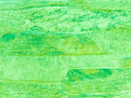 The old stone wall is green with damage. Green vintage background with brick texture.の写真素材