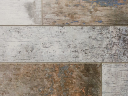 A wooden wall made of gray and brown boards. Vintage background with wooden texture.
