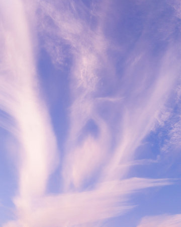 High clouds in the blue sky. Beautiful sky background with high white clouds.