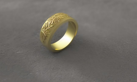 A beautiful gold ring with patterns rolling on a gray table. Jewelry on a gray background. generated AI.の素材