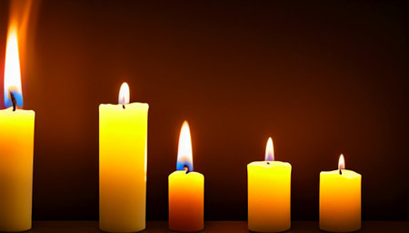 Five yellow candles of different heights on a dark background. Burning candles stand in a row on the table. home interior. International Candlelight Day. generated AI.の素材