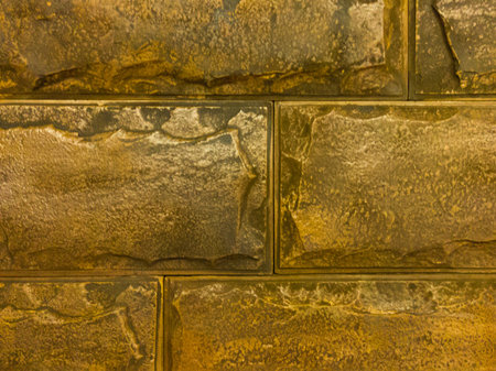 Yellow brick wall. Large smooth brick. Yellow warm background with horizontal brickwork.