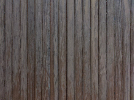 An old brown wall with a vertical texture. Gray brown background made of wooden planks. Wooden texture.の写真素材