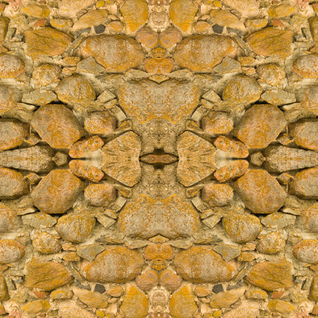 An old stone wall. Background of yellow stones. Stone texture. Yellow stones. Seamless. Symmetricalの写真素材