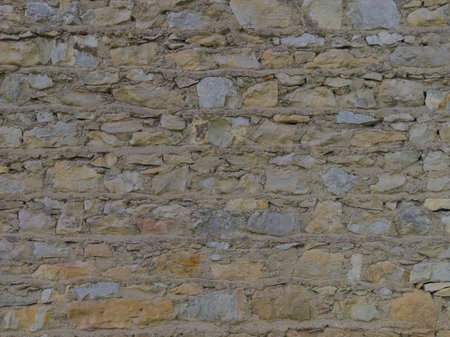 An old, gray wall made of stone and cement. Grey, stone background. Stone texture.の写真素材