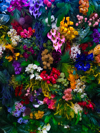Bright floral background with beautiful, colorful flowers. A beautiful wall of bright, colorful flowers. Vertical image.の写真素材