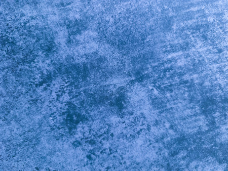The old worn-out wall is blue. Blue background with damage. Blue texture.の写真素材
