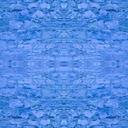 An old, blue wall made of stone and cement. Blue, stone background. Ancient ruins. Stone texture. Seamless image. Symmetricalの写真素材