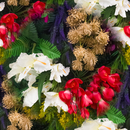 Bright floral background with beautiful, colorful flowers. A beautiful wall of bright, colorful flowers. Close-up. Vertical image. Seamless image.の写真素材